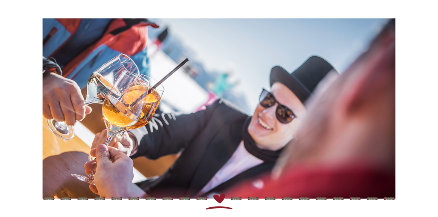 Masked people toasting with their drinks.